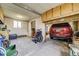 Detached two-car garage has room for storage and parking; has a wheelchair and other items stored inside at 7651 Shoshone St, Denver, CO 80221
