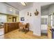 Charming kitchen area flowing into the living space and featuring updated finishes at 7651 Shoshone St, Denver, CO 80221