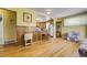 Open concept living area featuring hardwood floors and easy access to the kitchen at 7651 Shoshone St, Denver, CO 80221