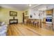 Bright and airy living space with hardwood flooring and open flow to the kitchen at 7651 Shoshone St, Denver, CO 80221