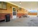 Covered patio with brick accents and outdoor seating offering an ideal space for relaxation at 7651 Shoshone St, Denver, CO 80221