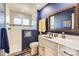 Modern bathroom with a glass shower, stylish accents, and a sleek vanity at 2117 S Troy Way, Aurora, CO 80014