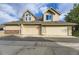 Exterior of a townhouse featuring a garage and well-maintained landscaping at 2117 S Troy Way, Aurora, CO 80014