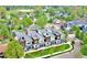Aerial view of modern townhomes in a green community, close to parks and green spaces at 4035 Fenton Ct, Wheat Ridge, CO 80212