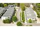 Aerial view of a meticulously maintained community with tree-lined streets and contemporary townhome architecture at 4035 Fenton Ct, Wheat Ridge, CO 80212