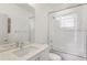 Bright bathroom features a shower over tub, quartz countertop, and modern fixtures at 4035 Fenton Ct, Wheat Ridge, CO 80212