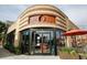 Street view of a brick building with large windows and outdoor seating, blending urban charm with modern style at 4035 Fenton Ct, Wheat Ridge, CO 80212