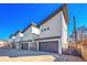 Modern townhome featuring a sleek design, garages, and clean architectural lines at 4035 Fenton Ct, Wheat Ridge, CO 80212