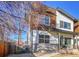 Modern home with a combination of wood and white siding, complemented by a well-maintained yard and a fence at 4035 Fenton Ct, Wheat Ridge, CO 80212