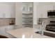Kitchen with stainless steel appliances, and pantry in the background at 4035 Fenton Ct, Wheat Ridge, CO 80212