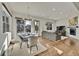 Bright open-concept living space leads to a dining area with modern decor at 4035 Fenton Ct, Wheat Ridge, CO 80212