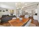 Bright open-concept living space featuring a cozy fireplace and modern lighting fixtures at 4035 Fenton Ct, Wheat Ridge, CO 80212