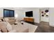 Relax in this cozy living room, complete with a plush sectional and stylish decor at 4035 Fenton Ct, Wheat Ridge, CO 80212