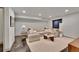 Spacious living room features modern lighting, comfortable seating, and sleek flooring at 4035 Fenton Ct, Wheat Ridge, CO 80212