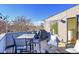 Relaxing rooftop deck features outdoor dining and lounge seating with neighborhood views at 4035 Fenton Ct, Wheat Ridge, CO 80212