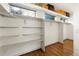 Spacious walk-in closet with built-in shelving and clothing rods for maximum organization at 4035 Fenton Ct, Wheat Ridge, CO 80212