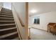 Finished basement space with carpeted floors, a window, and stairs at 4821 N Silverlace Dr, Castle Rock, CO 80109