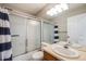 Bathroom featuring a shower and bathtub combo at 4821 N Silverlace Dr, Castle Rock, CO 80109