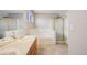 Bathroom features a double sink vanity, soaking tub, and glass-enclosed shower at 4821 N Silverlace Dr, Castle Rock, CO 80109