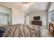 Spacious bedroom with a ceiling fan, TV, and access to an ensuite bathroom at 4821 N Silverlace Dr, Castle Rock, CO 80109