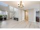 Inviting living room with staircase, light wood flooring, and a bench at 4821 N Silverlace Dr, Castle Rock, CO 80109