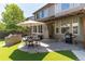 Backyard featuring an outdoor kitchen area, grill, patio, and outdoor seating at 3791 Charterwood Cir, Highlands Ranch, CO 80126