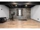 This basement features a work out area, an egress window, and luxury vinyl plank flooring at 3791 Charterwood Cir, Highlands Ranch, CO 80126