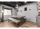 Finished basement features a dining area, luxury vinyl plank flooring, and lighting at 3791 Charterwood Cir, Highlands Ranch, CO 80126