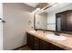 Bathroom featuring double sinks, tiled countertop and dark brown cabinets at 3791 Charterwood Cir, Highlands Ranch, CO 80126