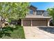 Charming home with a two-car garage, a front porch, landscaped yard, and a mature tree at 3791 Charterwood Cir, Highlands Ranch, CO 80126