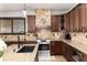 Well-appointed kitchen with granite countertops, stainless steel appliances, and ample cabinet space at 3791 Charterwood Cir, Highlands Ranch, CO 80126