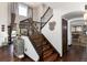 Elegant staircase featuring wood and stone details, with views of the home's modern decor at 3791 Charterwood Cir, Highlands Ranch, CO 80126