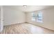 Bedroom features two bright windows, vinyl wood-look floors and base molding at 311 Harrison Ave, Fort Lupton, CO 80621