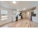 Contemporary kitchen with white cabinets, quartz countertops, and stainless steel appliances at 311 Harrison Ave, Fort Lupton, CO 80621