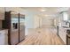 Spacious kitchen with stainless steel appliances and an open layout to the living room at 311 Harrison Ave, Fort Lupton, CO 80621