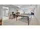Spacious basement area with neutral carpet, a computer desk, and a ping pong table, perfect for recreation at 12423 W 68Th Ave, Arvada, CO 80004