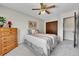 Bedroom with bed, wood dresser and carpet at 12423 W 68Th Ave, Arvada, CO 80004