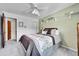 Neutral bedroom featuring a ceiling fan, carpet and a closet with doors at 12423 W 68Th Ave, Arvada, CO 80004