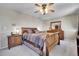 Bedroom with wood furniture, a comfortable bed, and neutral carpet at 12423 W 68Th Ave, Arvada, CO 80004