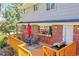 Outdoor deck with seating area, a grill, and a bar window overlooking the backyard at 12423 W 68Th Ave, Arvada, CO 80004
