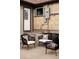 Backyard patio featuring comfortable seating, a brick facade, and a cozy outdoor area at 4828 W 32Nd Ave, Denver, CO 80212