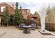 Cozy backyard patio featuring a fire pit and comfortable seating, perfect for outdoor entertaining at 4828 W 32Nd Ave, Denver, CO 80212