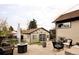 Landscaped backyard with a detached garage, patio furniture, and an inviting outdoor space at 4828 W 32Nd Ave, Denver, CO 80212
