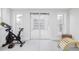Bright basement area with fitness equipment and light filled windows, perfect for exercise at 4828 W 32Nd Ave, Denver, CO 80212