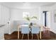 Cozy dining area with stylish chairs, hardwood floors, and natural light at 4828 W 32Nd Ave, Denver, CO 80212
