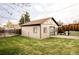 Detached garage with modern door, lush lawn and fenced perimeter, adding convenience at 4828 W 32Nd Ave, Denver, CO 80212