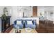 Bright living room featuring a fireplace, hardwood floors and views into the kitchen and dining area at 4828 W 32Nd Ave, Denver, CO 80212