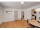 Warm dining area with classic hardwood floors and seamless kitchen access at 2158 S Ash St, Denver, CO 80222