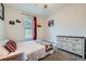 Serene bedroom featuring a queen-size bed, dresser, and a window view at 3127 W 28Th Ave # 2, Denver, CO 80211