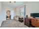 Bedroom featuring a desk, sofa and a walk-through to an additional room at 3127 W 28Th Ave # 2, Denver, CO 80211